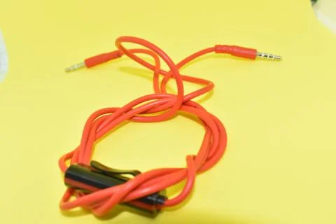 High-quality audio cable for display in yellow background. Foto stock