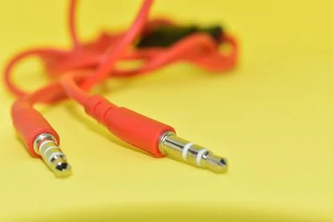 High-quality audio cable for display in yellow background. Stock Photos