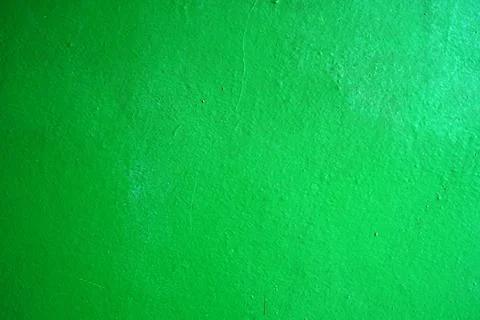 High quality close-up image of a bright green wall with detailed paint texture Stock Photos