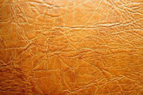 High quality close-up image of brown textured leather or faux leather. Stock Photos