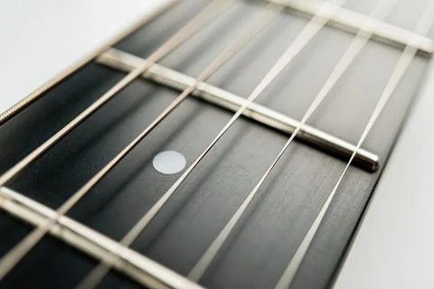 High-quality guitar string set against a white background, showcasing unifo.. Stockfoto's