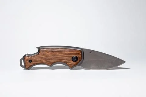 High-quality image featuring a stylish modern pocket knife with a durable woo Stock Photos