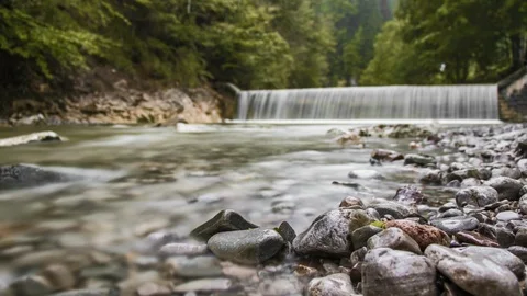 High quality long exposure timelapse footage of a weir and flowing stream. Stock Footage 95449627