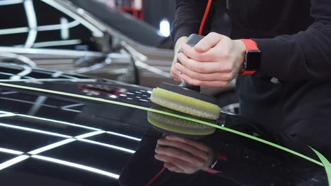 High-quality polishing of car in the workshop, removing scratches and dents Stock Footage 115934192