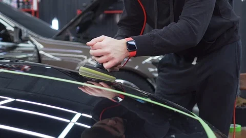 High-quality polishing of car in the workshop, removing scratches and dents Stock Footage 115934666