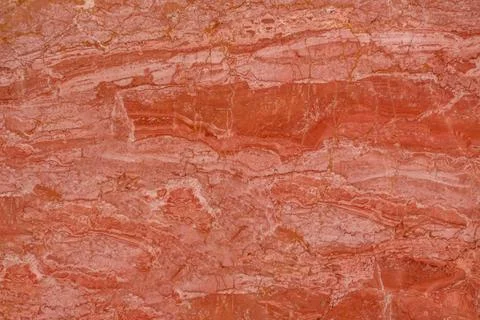 High-quality red marble surface featuring intricate golden patterns, perfe... Stock Photos