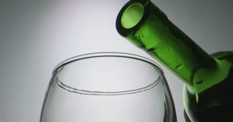 High quality red wine pouring into a glass in extreme slow motion, stream of Stock-Footage 133125396