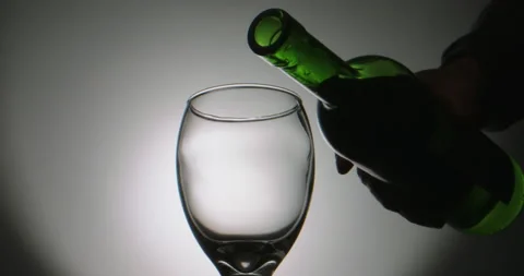 High quality red wine pouring into a glass in extreme slow motion, stream of Stock-Footage 133345845