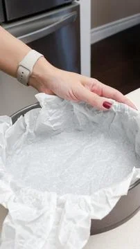 High-quality round cake pan featuring a non-stick parchment paper liner for e Stock Photos