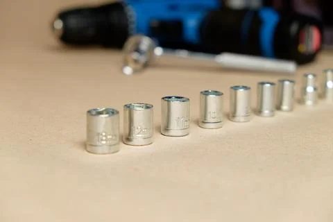 High-quality sockets with battery-powered drill and essential accessories Stock Photos