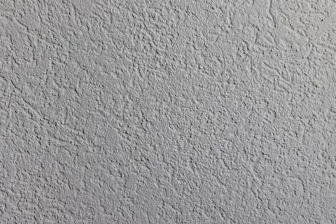 High quality texture of a textured interior wall painted matte white. Stock Photos