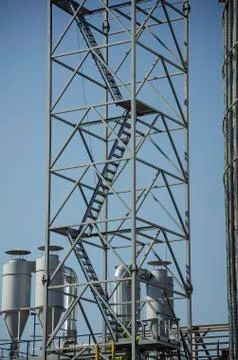 High rectangular steel structure with stairs against the sky. Stock Photos
