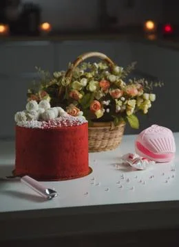High red cake stands on a white table and piece of cake. Stock Photos