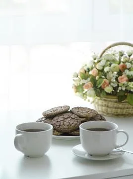 High red cake stands on a white table and piece of cake. Stock Photos