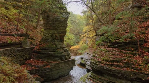 High-resolution 4K footage of a cascading autumn waterfall at Buttermilk Falls S Stock Footage 304227594