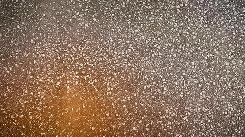 High-resolution 4K texture of light brown asphalt road surface with small s.. Illustrazione stock