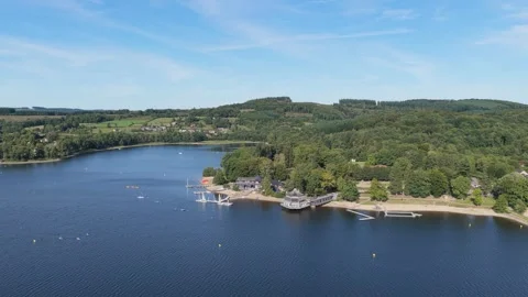 High-resolution aerial footage of Lac des Settons, a scenic lake surrounded by Stock Footage 346693530