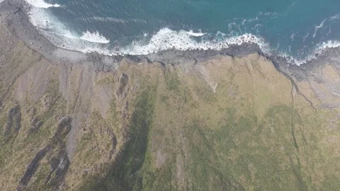 High-resolution aerial footage showcasing the dramatic rocky coastline and Stock Footage 346720198