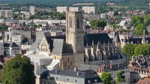 A high-resolution aerial shot of the historic Nevers Cathedral, prominently Stock Footage 346707327