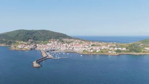 A high-resolution aerial video captures the scenic coastal town of Finisterre in Stock Footage 346703983