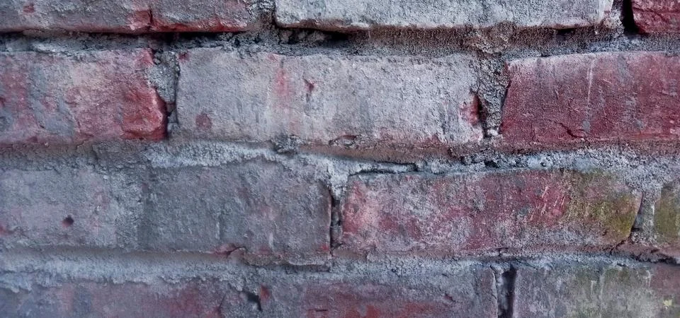High-resolution background image featuring a red brick wall texture Stock Photos