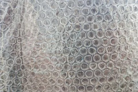 High-resolution close-up image of transparent bubble wrap, showcasing its i.. Stock Photos