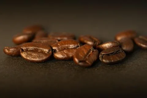 High resolution of coffee grains on a table Stock Photos
