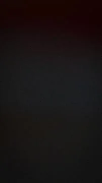 A high resolution dark textured background displaying subtle gradient shades  库存插图