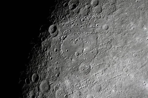High resolution detailed view of the lunar surface showing numerous impact .. イラスト素材
