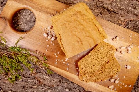 High-resolution image of seed and nut bread on a wooden board, with a natural Stock Photos