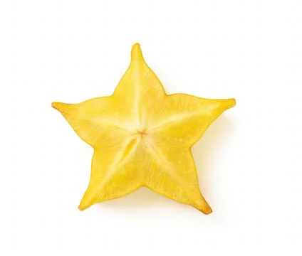 High resolution macro shot of ripe juicy carambola starfruit slice isolated. Foto stock