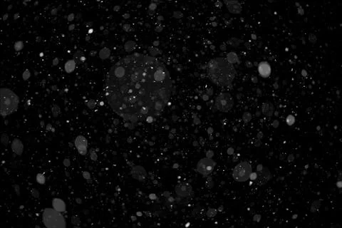 High resolution real heavy falling snow isolated on solid black background. f Stock-Fotos