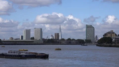 High ride blocks, dock warehouse and the Shard from Greenwich in London, England Stock Footage 112976386