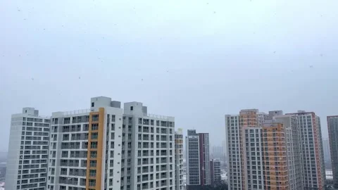 A high-rise apartment complex with snow in winter Stock Footage 260862480