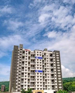 High rise building on a backdrop of nice cloudscape showing latest development. Stock Photos