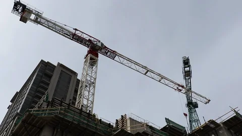 High rise building construction. Heavy machinery crane for building condos in th Vídeos de archivo 87480284