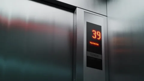 High-rise building elevator malfunctioning, overload warning, machinery error Stock Footage 334723126