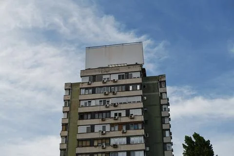High-rise building with empty with copy space billboard frame on the roof u.. Stock Photos