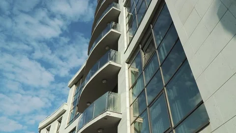 High-rise building with large panoramic windows. The camera shoots from below 動画素材 142493098