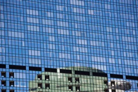 High rise building reflected in another in Shiodome district Tokyo. Japan Stock Photos