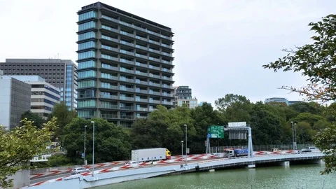 A high rise building on the side of the road in Tokyo Japan Stock Footage 121370644