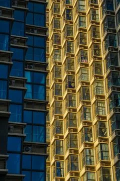 High rise building with sun bouncing of sides Stock Photos