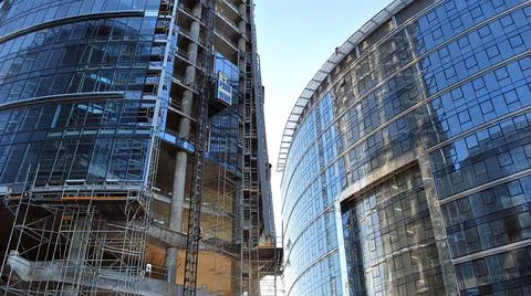 High-rise building under construction. Modern office building. Stock Photos