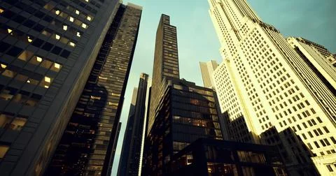 High rise buildings create a striking city skyline under clear skies Ilustração Stock