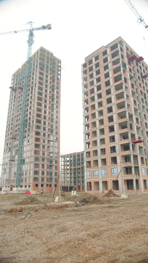 High-Rise Buildings Under Construction with Tower Crane Stock Footage 296755615