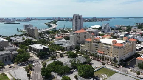 High-rise condo tower overlooks curving causeway bridge in downtown Clearwater Stock Footage 340180957