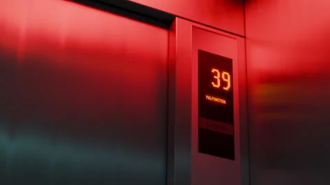 High-rise elevator malfunctioning while descending, warning light, safety risk Stock Footage 334723110