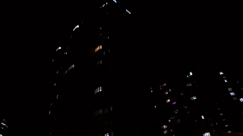 High-rise with light in the windows. Luminous windows of a high-rise Stock Footage 304423424