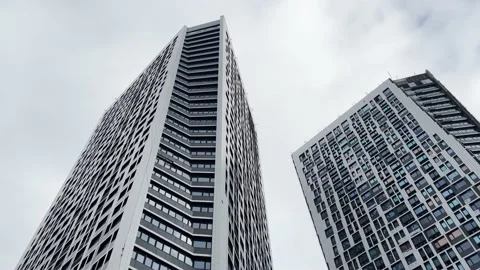 High-rise modern building on cloudy sky. Low angle aerial view. Stock Footage 224708425