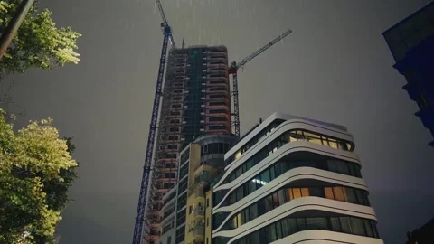 High Rise Skyscraper Construction Site at Night Stock Footage 345901461